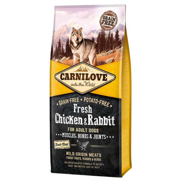 Carnilove Fresh Chicken & Rabbit dog food bag with wolf image; text highlights grain-free, potato-free, wild meats.