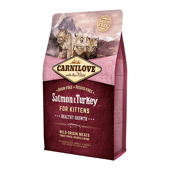 Carnilove kitten food: Salmon & Turkey. Wildcat image, mountain backdrop. 